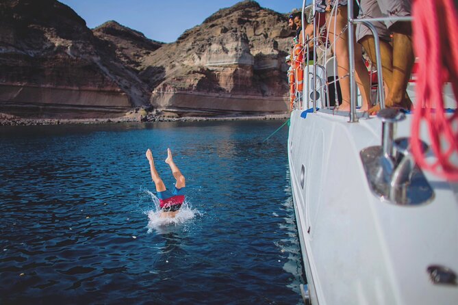 Beautiful Day Catamaran Caldera Cruise incl. Meal & Drinks - Stop 2: White Beach and Mesa Pigadia, Plus Snorkel Gear Included