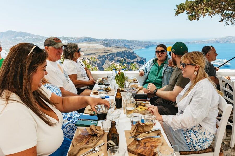 Fira: Guided Foodie Walking Tour with Tastings - Along the caldera edge, with Aegean and volcano views