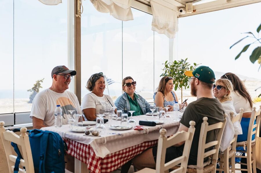 Fira: Guided Foodie Walking Tour with Tastings - Market time and a caldera-view midday meal