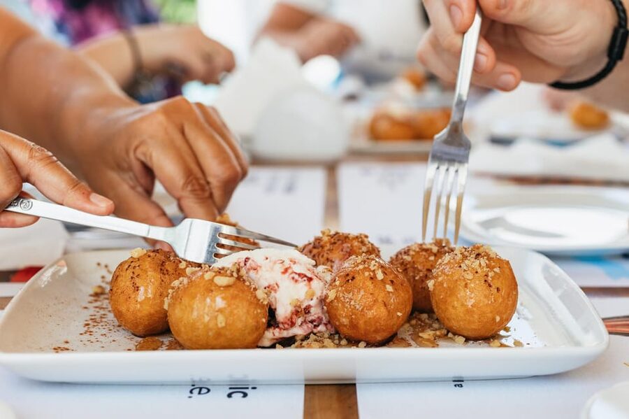 Fira: Guided Foodie Walking Tour with Tastings - Blue-domed church vibes and a traditional meze first course