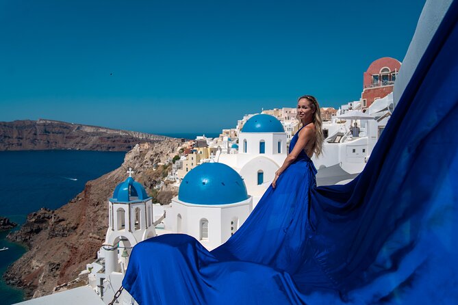 Flying Dress Photoshoot in Oia Private entry to Blue Dome - Photo set expectations: 20 to 30 images in about an hour