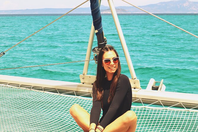 Full Day Santorini Catamaran Private Cruise with meal and transfer - Stop by stop: Red Beach and White Beach, the volcanic color contrast