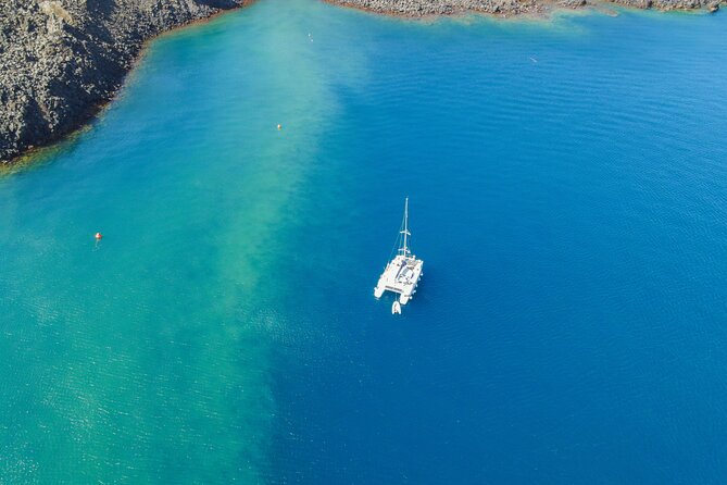 Full Day Santorini Catamaran Private Cruise with meal and transfer - Thirassia and the small island stops: seeing the caldera off the main route