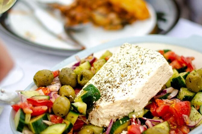 Greek Cuisine Cooking Class in Santorini with Recipes and Wine - Dish by Dish: Tzatziki, Greek Salad, Tomato Fritters, and Pasticcio