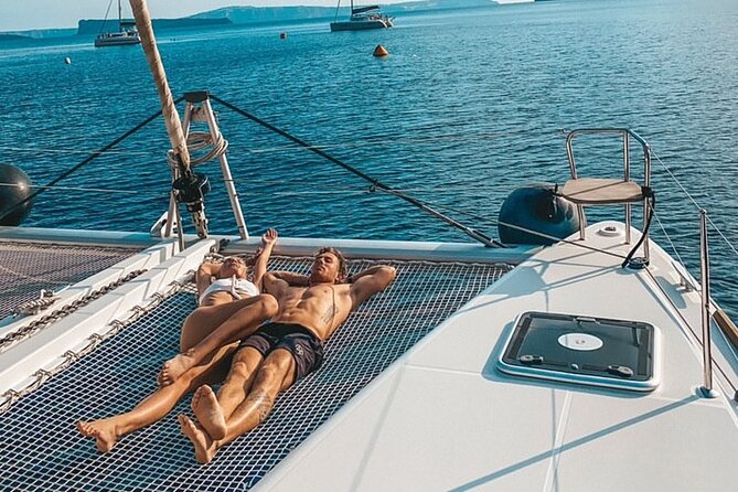 Half-Day Exclusive Catamaran Cruise in Santorini with Meal and Open Bar - Red Beach: The Color Show You See Better From the Water