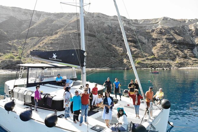 Half-Day Exclusive Catamaran Cruise in Santorini with Meal and Open Bar - Weather, Sea Conditions, and What to Do Before You Board