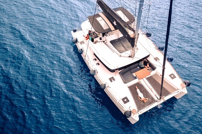 Half Day Premium Catamaran Cruise in Santorini including Oia - Red Beach vs. volcanic hot springs: pick your swim mood