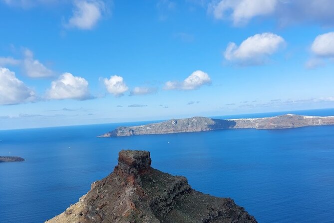 Hiking activity through the volcanic land of wonder - Oia village walk: traditional streets and everyday life context