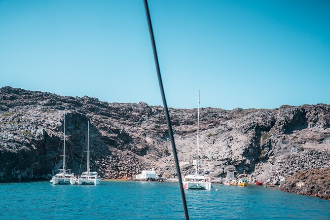 Majestic Catamaran Caldera Cruise with Snacks, Meal & Drinks - Crew energy and safety: Captain Giannis and Giorg show up in the stories