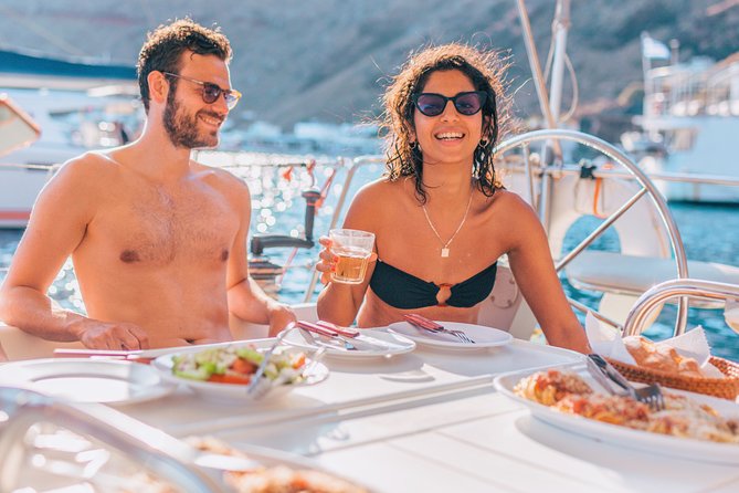 Morning Caldera Sailing Cruise - Red Beach swim stop: volcanic color and short, sweet water time