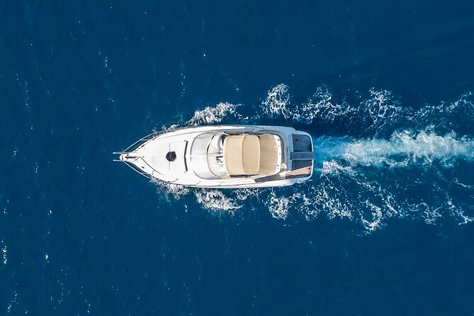 Private all included yacht Tour in Santorini - Cruising past Fira, Firostefani, Imerovigli, and the Old Port
