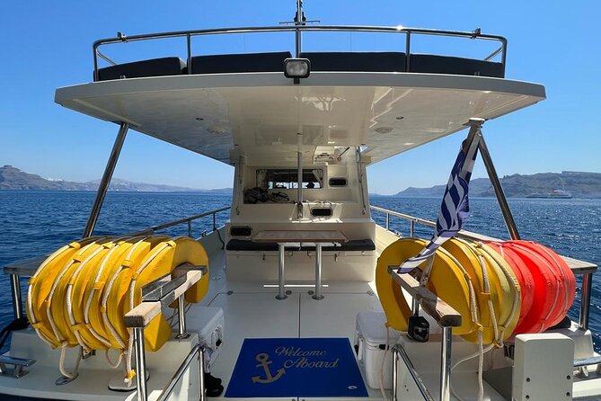 Private Full-Day Motor Yacht Cruise with Meal, Open Bar+Transfers - From Vlychada port to the Red and White Beach swim stops