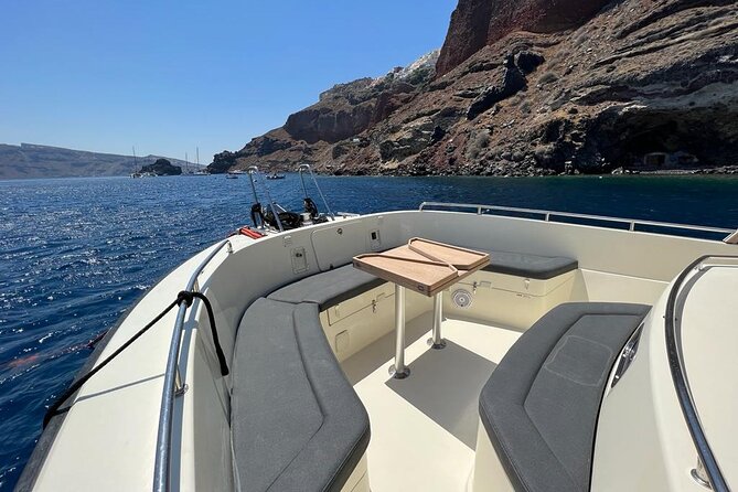 Private Full-Day Motor Yacht Cruise with Meal, Open Bar+Transfers - Akrotiri Lighthouse and the caldera approach you can’t replicate from shore
