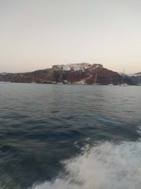 Private, fully customizable cruise in Santorini's caldera - Onboard snacks, drinks, and the value of small-group comfort