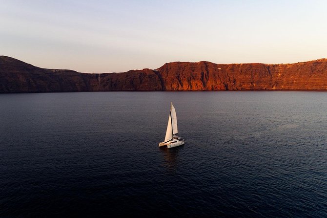 Private Luxury Caldera Cruise with a rich BBQ meal and Open Bar! - Black, red, and white sand beaches, seen from a boat