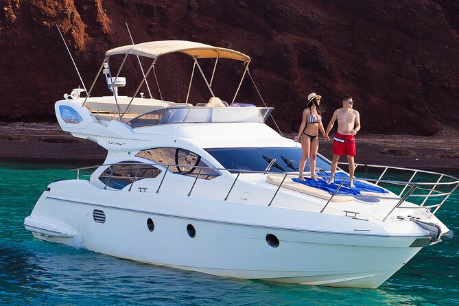 Private Motor Yacht Cruise with BBQ, Open Bar & Transfers - Volcanic caves, Indian Rocks, and caldera views that do not need hiking