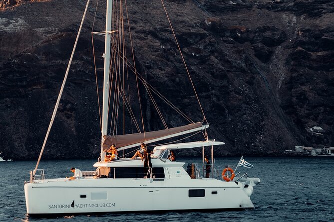 Romantic Sunset Catamaran Caldera Cruise incl. Meal & Drinks - Sailing Into Santorinis Caldera at Golden Hour