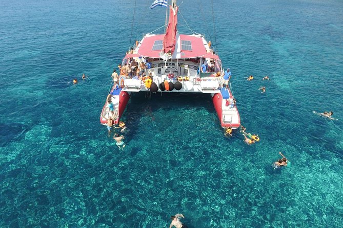 Sailing Catamaran Cruise in Santorini with BBQ, Drinks and Transfer - Red Beach Stop: Swim and Snorkel With a Dramatic Coastline