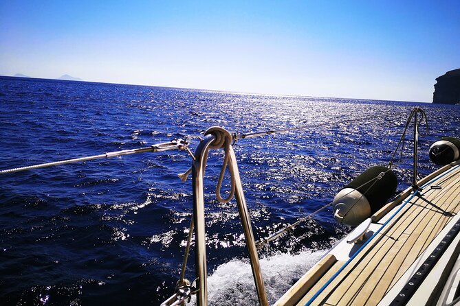 Sailsational Luxury Santorini Catamaran Sunset Cruise with Dinner - Stop 1: Red Beach from the water (35 minutes)