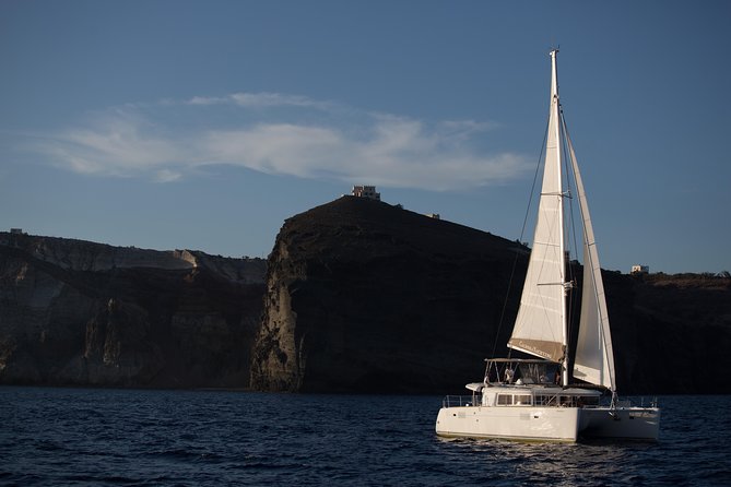 Santorini All-inclusive Catamaran Cruise with Thirassia Stop - Hotel pickup to old-port sailing from Amoudi