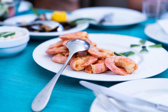 Santorini All-inclusive Private Catamaran Cruise - BBQ, seafood, and an open bar that makes the half-day feel like a vacation