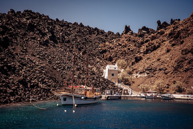 Santorini: Boat tour to Volcano, Hot Springs & Thirasia island - Palea Kameni hot springs swim: warm water, sulfur stains, and depth