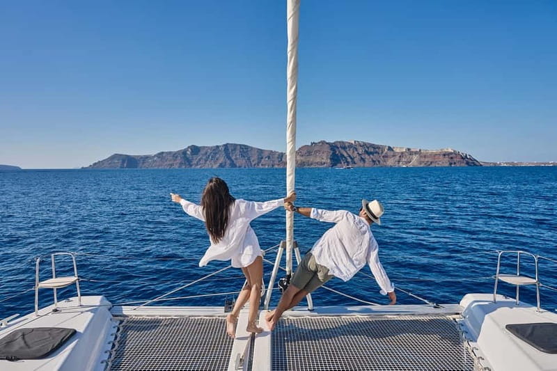Santorini: Caldera Classic Catamaran Cruise w/ Meal & Drinks - Red Beach Swimming and Snorkeling With Lunch In Motion