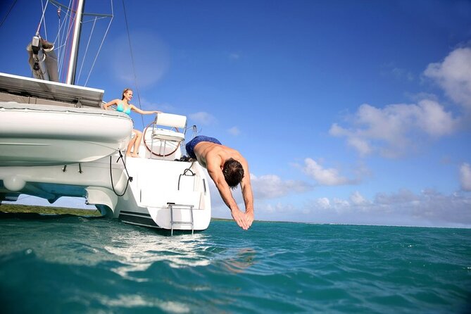 Santorini: Caldera Classic Semi-Private Cruise with BBQ & Drinks - Mesa Pigadia: a secluded black-sand swim with rock framing