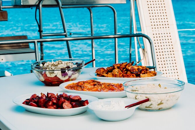 Santorini Caldera Gold Day Cruise with BBQ on board and Open Bar - Food, open bar, and the crew energy that keeps things smooth