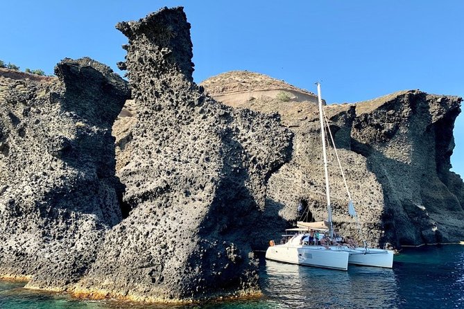 Santorini Caldera Gold Day Cruise with BBQ on board and Open Bar - Vlychada to Red Beach: where the caldera scenery starts moving