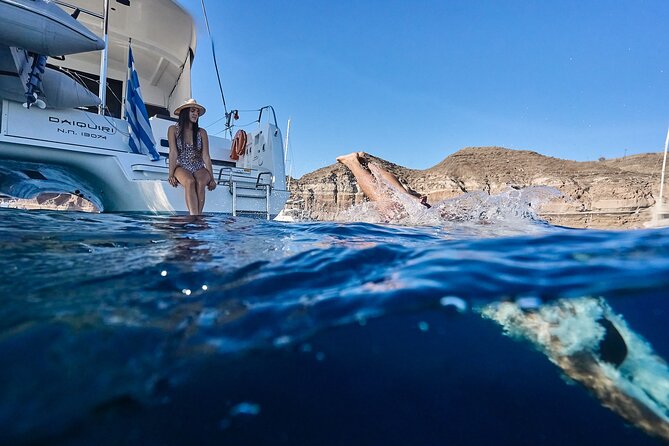 Santorini: Caldera Private Catamaran Cruise with Meal & Drinks - Mesa Pigadia’s Black-Sand Water, Plus a Lighthouse Pause