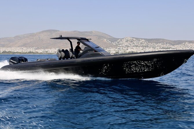 Santorini Caldera: Private Cruise with Speed Boat & Open Bar - The big caldera passes: Oia bay and the landmarks from the sea