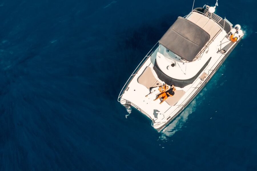 Santorini: Caldera Private Power Catamaran Cruise - Passing Indian Rock, Venetian Lighthouse, and Other Key Views