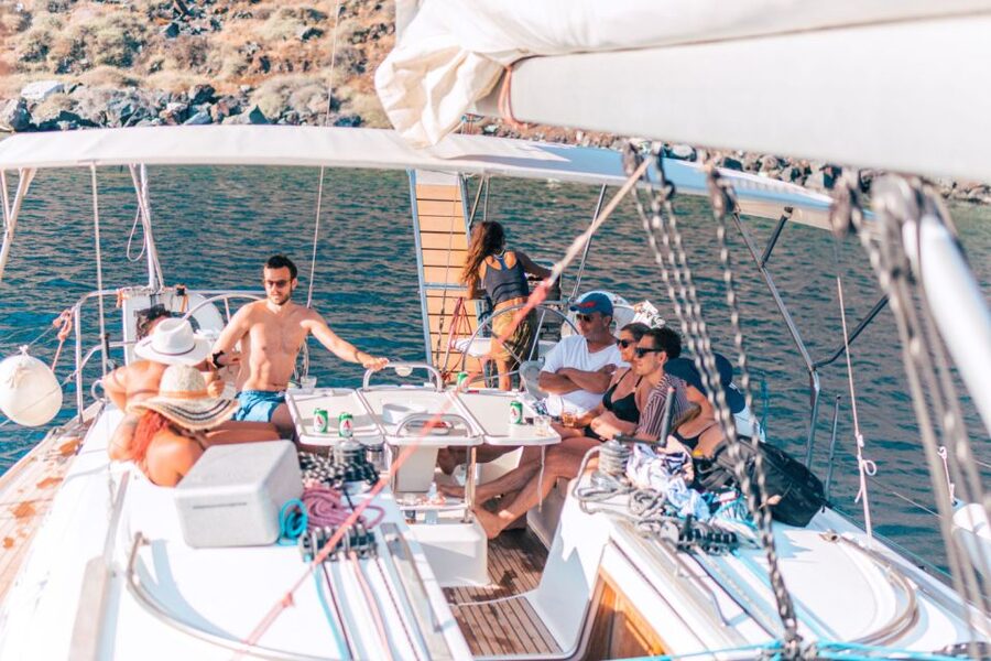Santorini Caldera: Sunset Sailing Cruise with Meal - Inside the Caldera: Indian Rock, the Lighthouse, and the White Towns Below