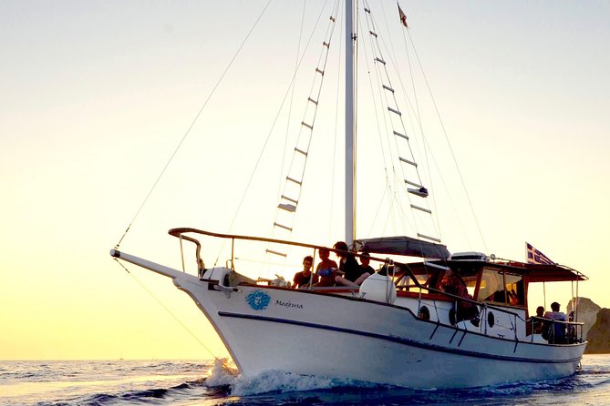 Santorini Caldera Sunset Traditional Cruise with Meal and Drinks - Mesa Pigadia and the rock pass, why this route feels special