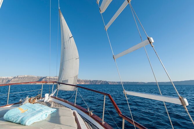 Santorini Caldera Sunset Traditional Cruise with Meal and Drinks - White Beach and Red Beach: boat-only color, fast photo windows