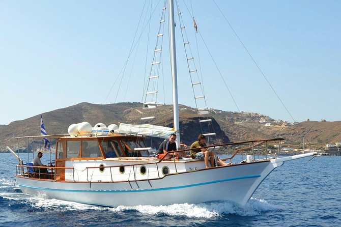 Santorini Caldera Sunset Traditional Cruise with Meal and Drinks - The onboard meal and drinks: what you get and how it works
