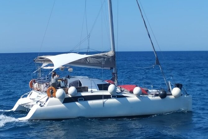 Santorini Catamaran Cruise – 5-Hour Private Sailing Experience - White Beach and the Lighthouse View: A Break for Snorkel Time and Sea Views