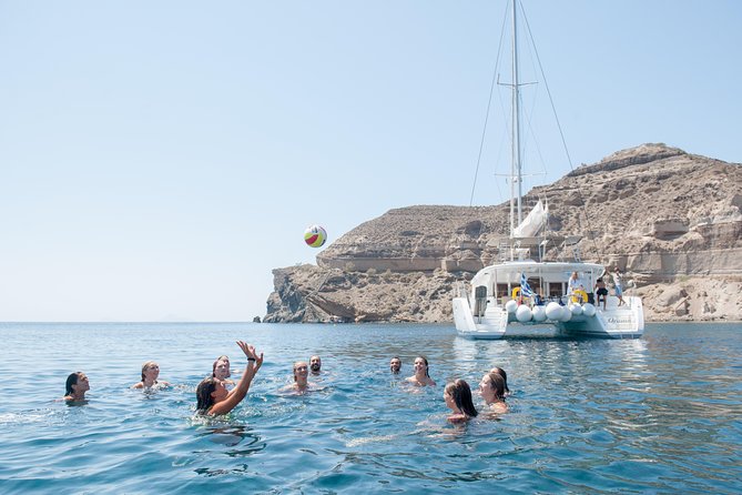 Santorini Catamaran Cruise with Fresh Meal and Open Bar - Akrotiri area sightings: lighthouse, Black Mountain, Indian Rock, and a cliff-face profile