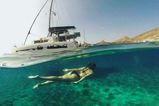 Santorini Catamaran Cruise with Fresh Meal and Open Bar - Palea Kameni hot springs: swim in warm sulfur water