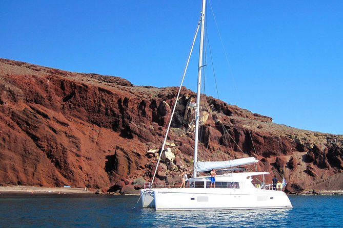 Santorini Catamaran Cruise with Fresh Meal and Open Bar - Deck time, snorkeling gear, and small-group comfort