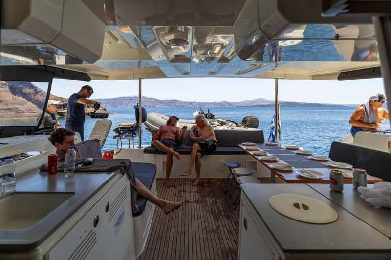 Santorini: Catamaran Cruise with Fresh Meal & Open Bar - Akrotiri Lighthouse: Guided Sights Between Water Stops