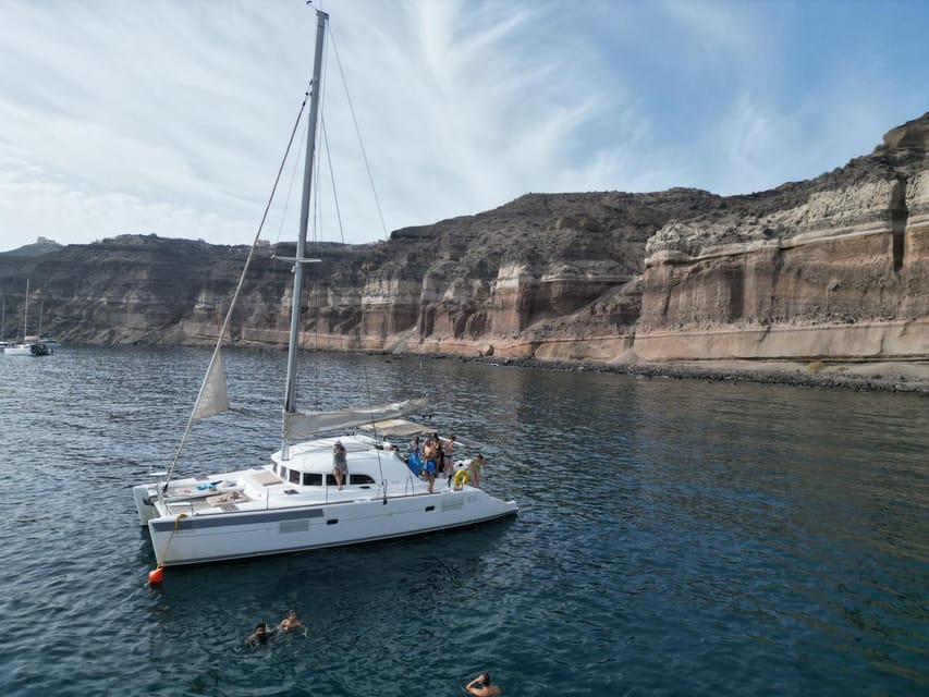 Santorini: Catamaran Cruise with Greek BBQ and Drinks - Group size, crew energy, and the vibe on the catamaran