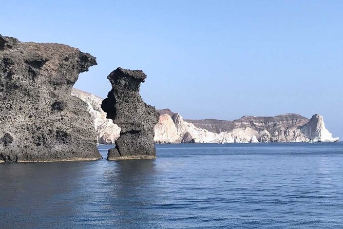 Santorini Catamaran Cruise with Greek Meal, Open-Bar and Sunset - The Nea Kameni Hot Springs Stop: Warm Water, Dark Suit, Short Swim
