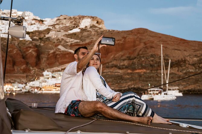 Santorini Catamaran Cruise with Greek Meal, Open-Bar and Sunset - Red Beach and the South Coast: Time to Swim, Then Ride the Caldera
