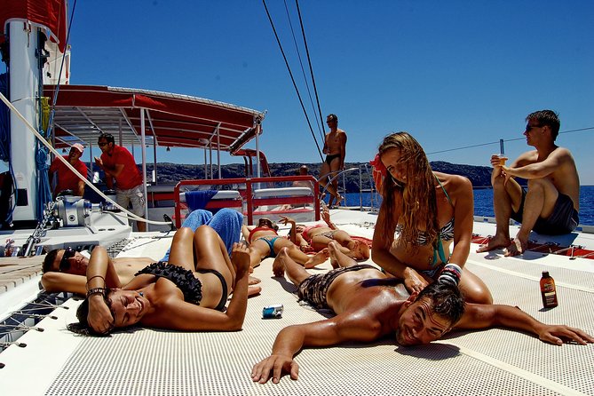 Santorini Cruise on Catamaran with BBQ & Open Bar - The Boat Setup: 360 Views, Canopy Seating, and Shoes Off