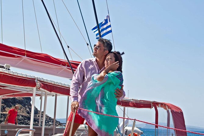 Santorini Cruise on Catamaran with BBQ & Open Bar - Stop 2: Red Beach Area for Photos, Snorkeling, and Unreachable Corners