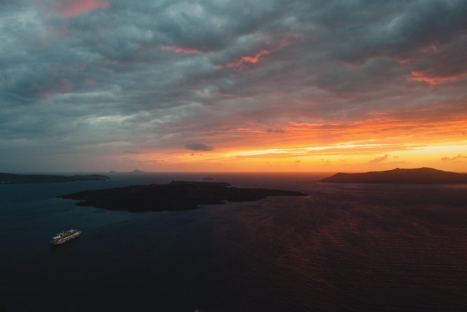 Santorini Customized Tours - Vlichada black-sand lunar beach and a Theros Wave Bar break
