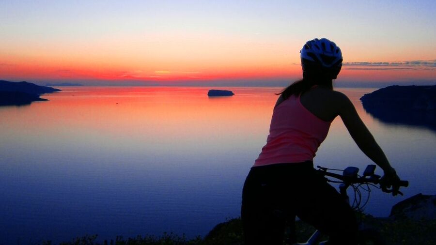 Santorini: Electric Mountain Bike Adventure - Caldera cliff views and a volcanic ash cave chapel moment