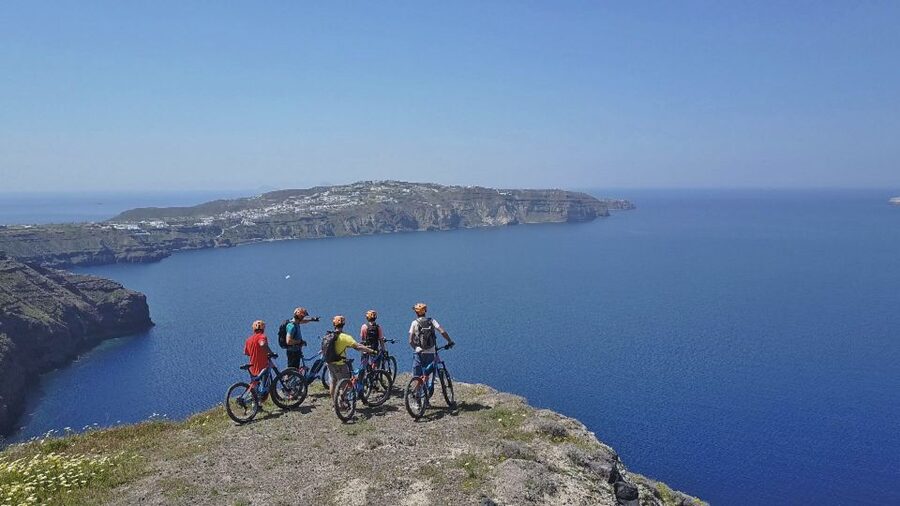 Santorini: Electric Mountain Bike Adventure - Perivolos black sand warm-up, then toward Thira’s ancient edges
